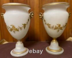Paired translucent, cylinder shaped, engraved & gilded white opaline glass vases