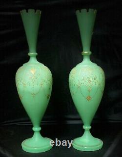 Paired, translucent, cylinder shaped, gilded green opaline glass vases